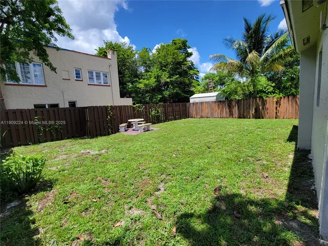 a house view with a garden space