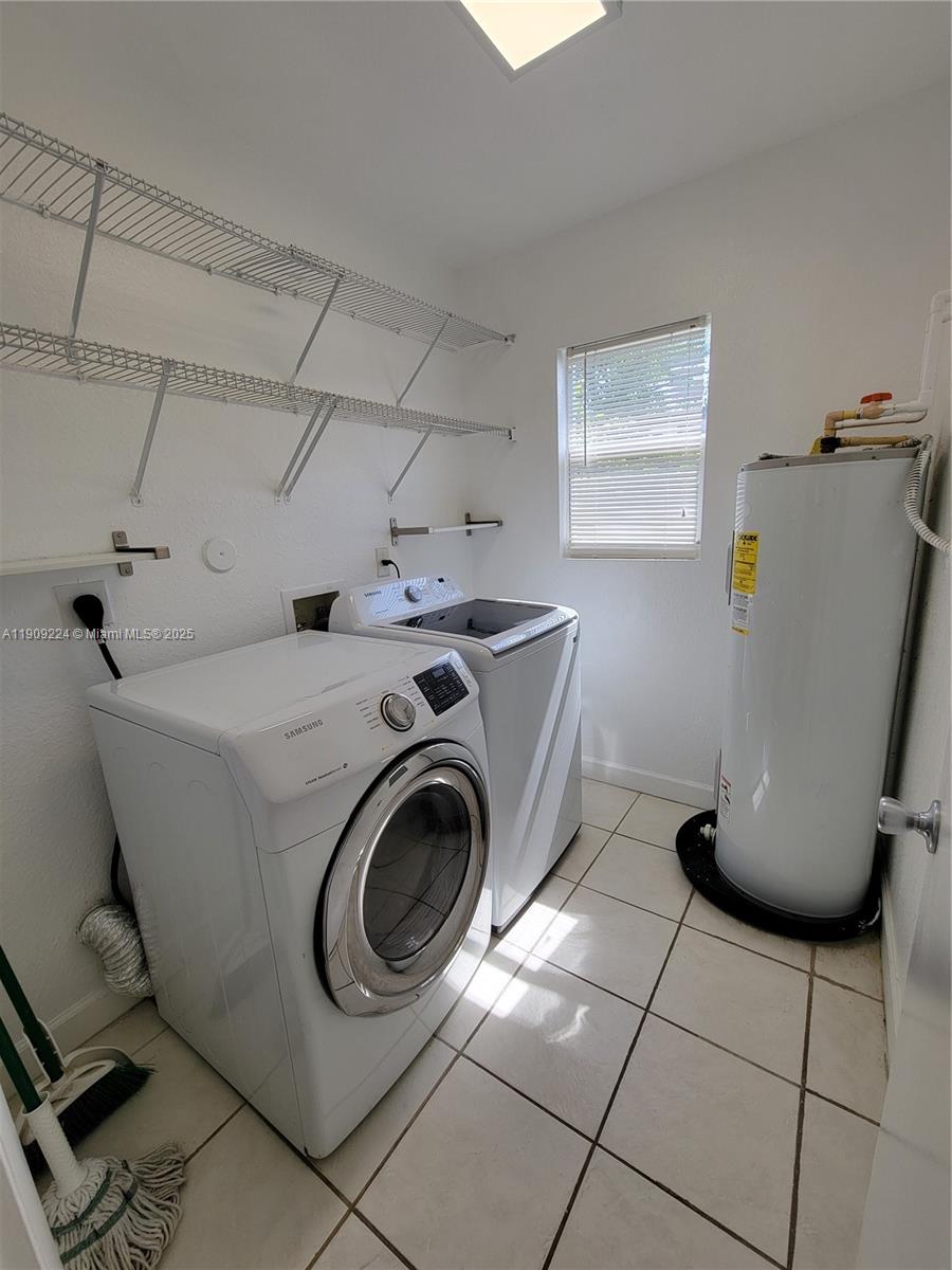 35 Southwest 7th Street, Unit 2 Hallandale Beach, FL 33009 - Photo 10 of 23 a utility room with dryer and washer