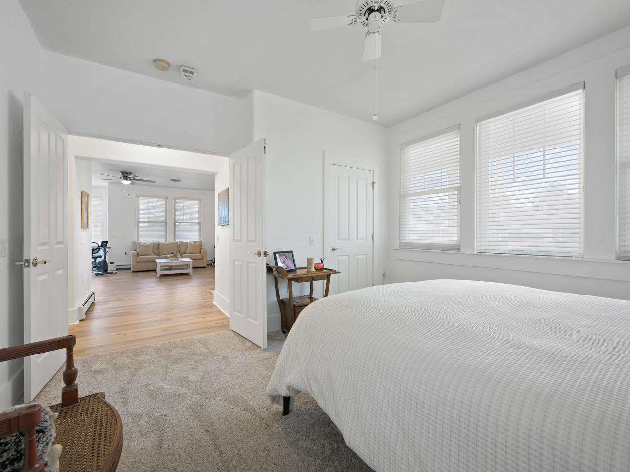 1117 Buttercup Lane Fruita, CO 81521 - Photo 21 of 25 a view of a bedroom with furniture and windows