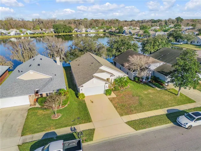 a view of a livingroom with furniture and a window