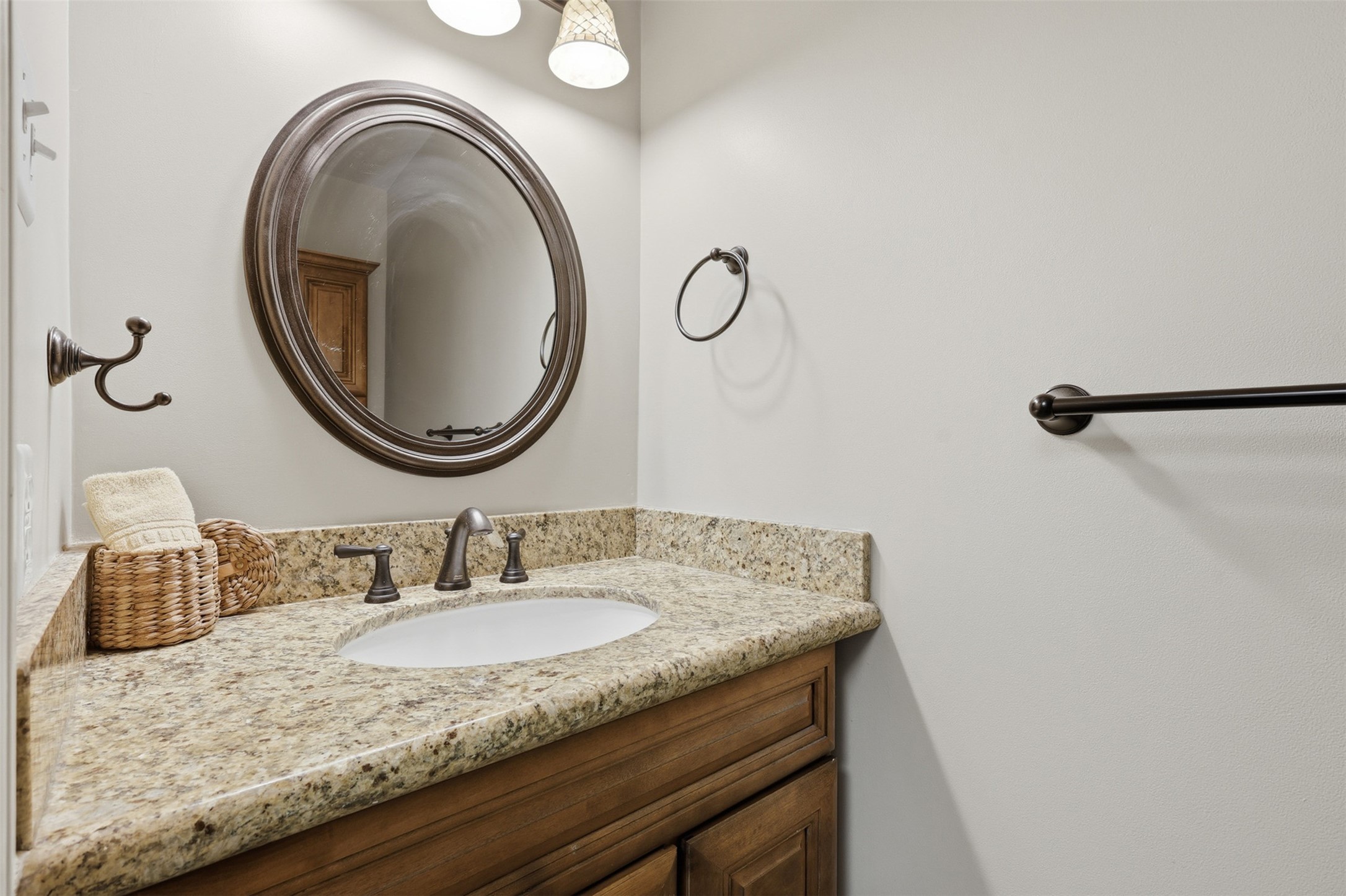 3415 Flickering Candle Drive Spring, TX 77388 - Photo 16 of 36 a bathroom with a granite countertop sink and a mirror