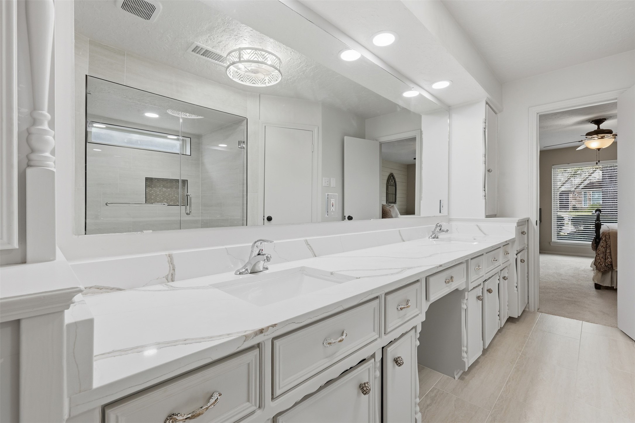 3415 Flickering Candle Drive Spring, TX 77388 - Photo 20 of 36 a bathroom with a double vanity sink and a mirror