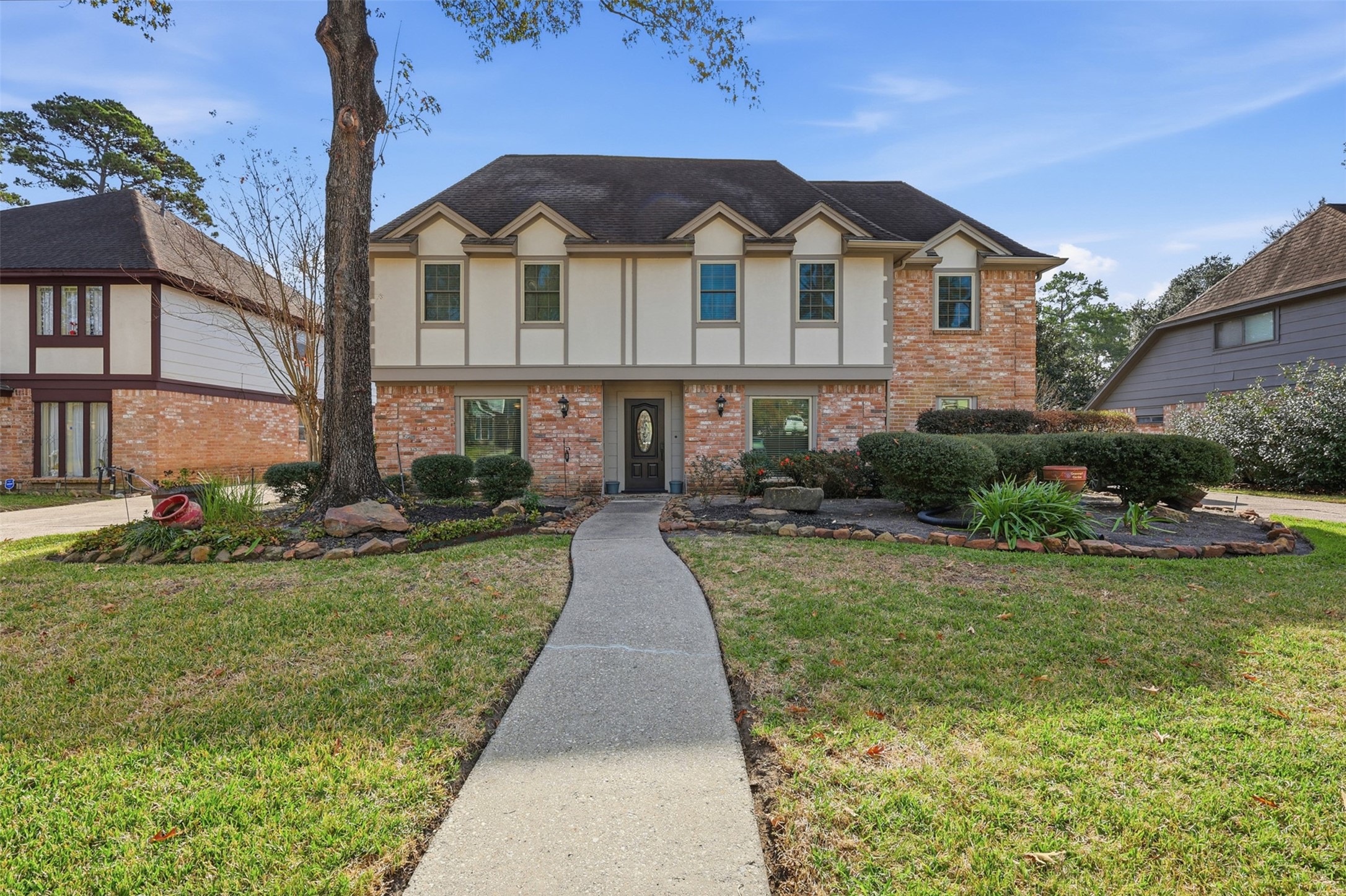 3415 Flickering Candle Drive Spring, TX 77388 - Photo 2 of 36 a front view of a house with a yard table and chairs