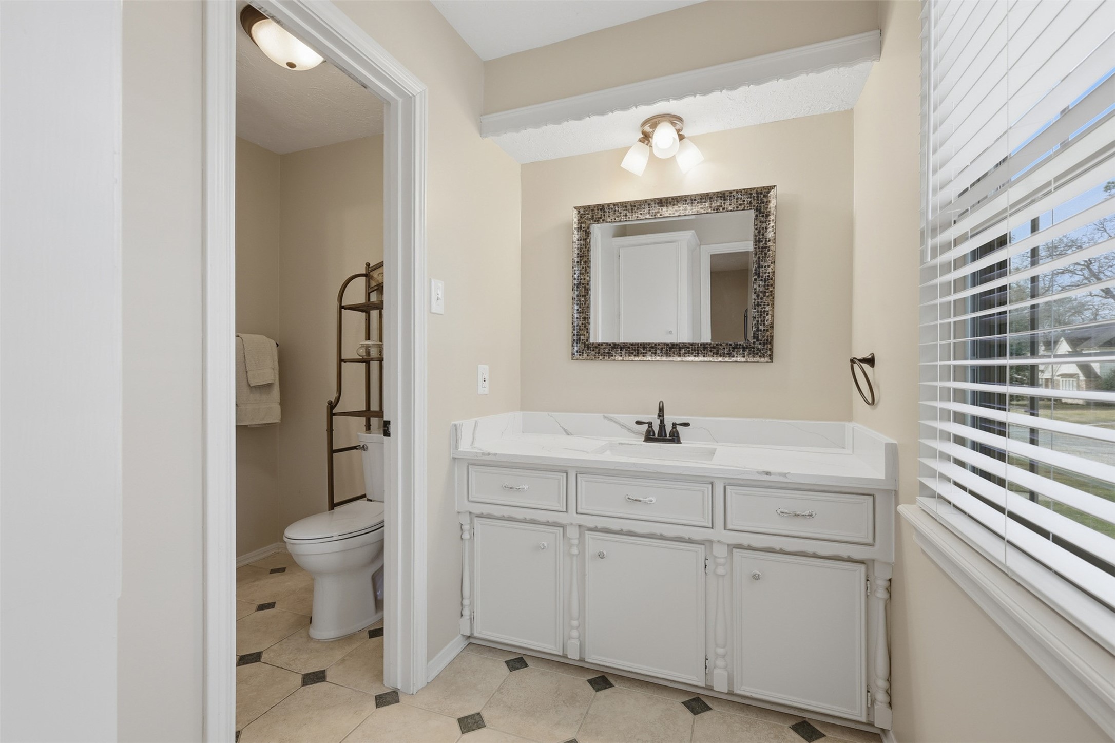 3415 Flickering Candle Drive Spring, TX 77388 - Photo 28 of 36 a bathroom with a toilet sink and mirror