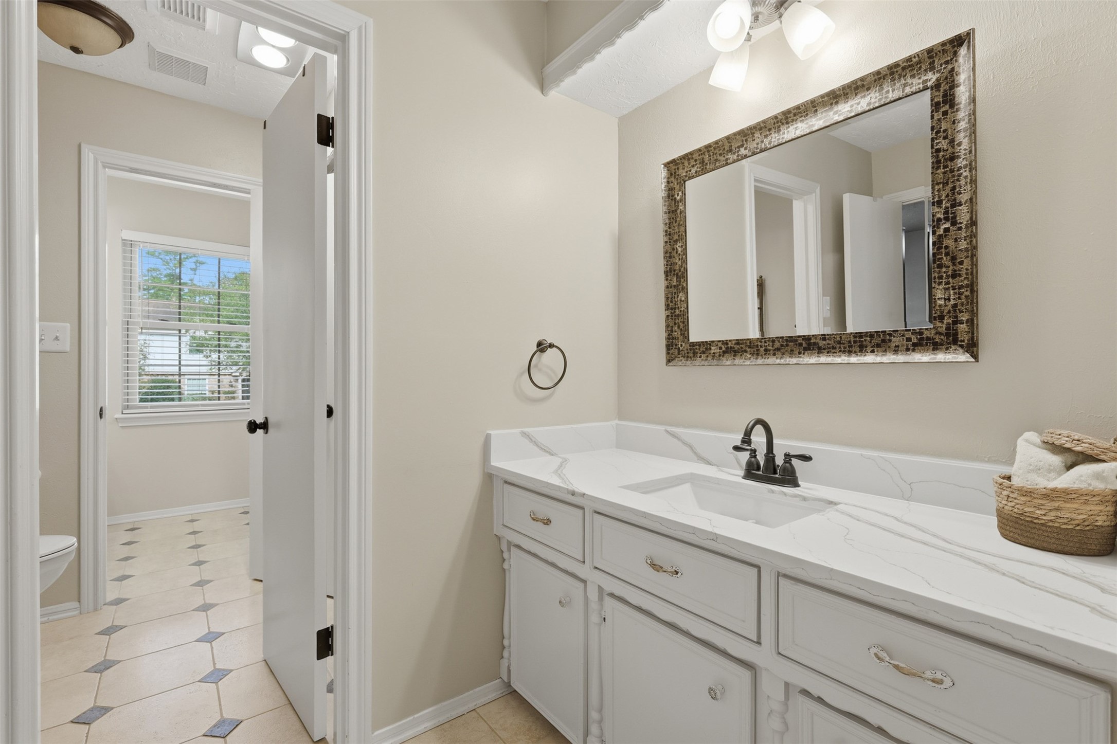 3415 Flickering Candle Drive Spring, TX 77388 - Photo 30 of 36 a bathroom with a sink a vanity and a mirror