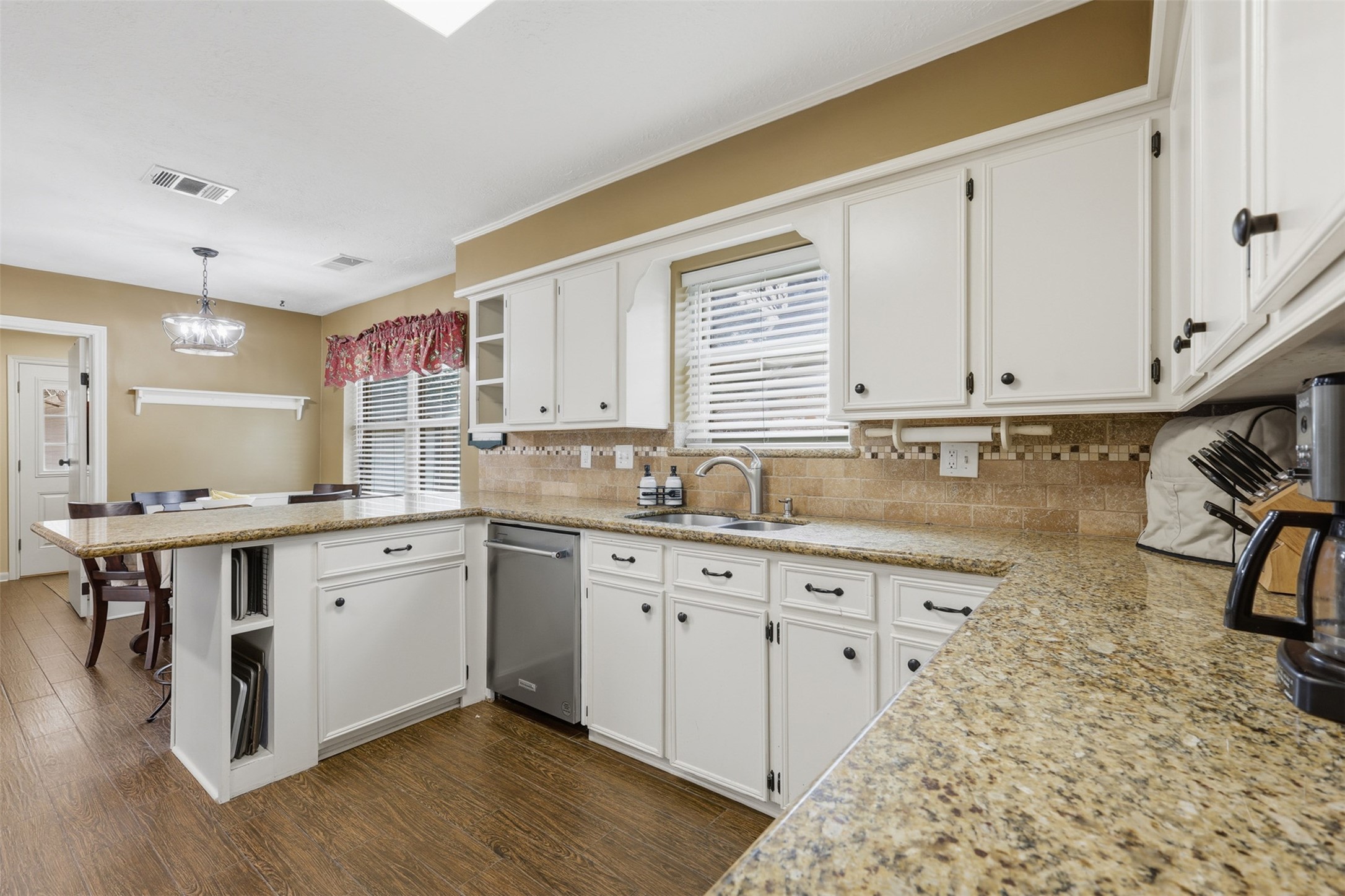 3415 Flickering Candle Drive Spring, TX 77388 - Photo 32 of 36 a kitchen with a sink stove and cabinets