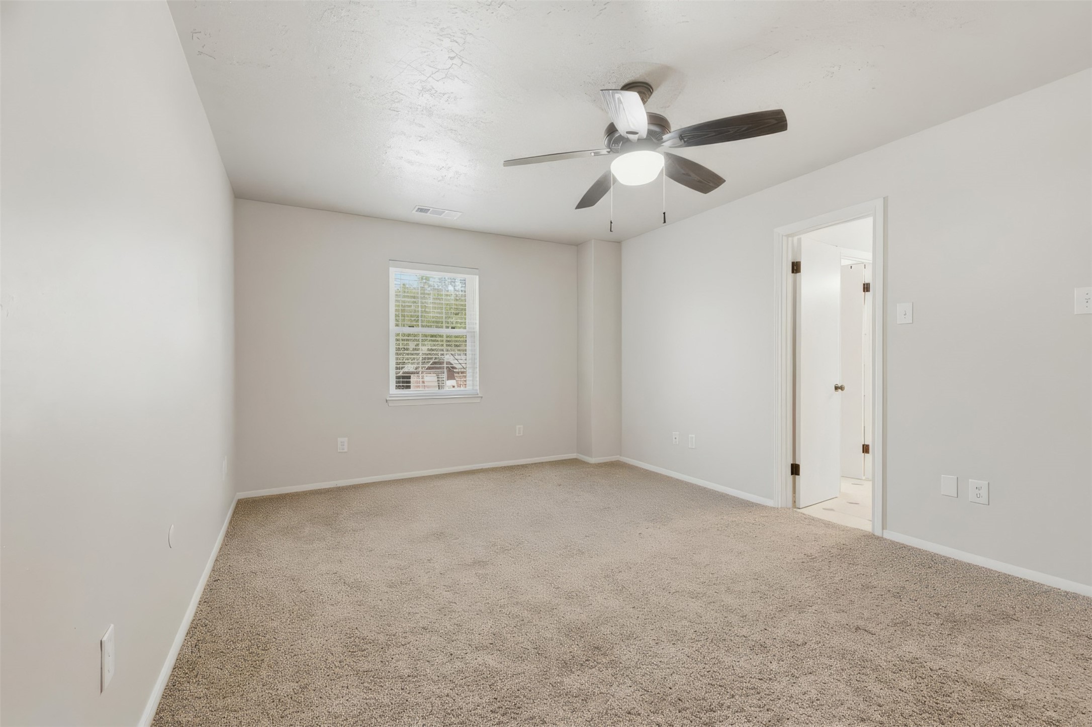3415 Flickering Candle Drive Spring, TX 77388 - Photo 33 of 36 an empty room with a window and a fan