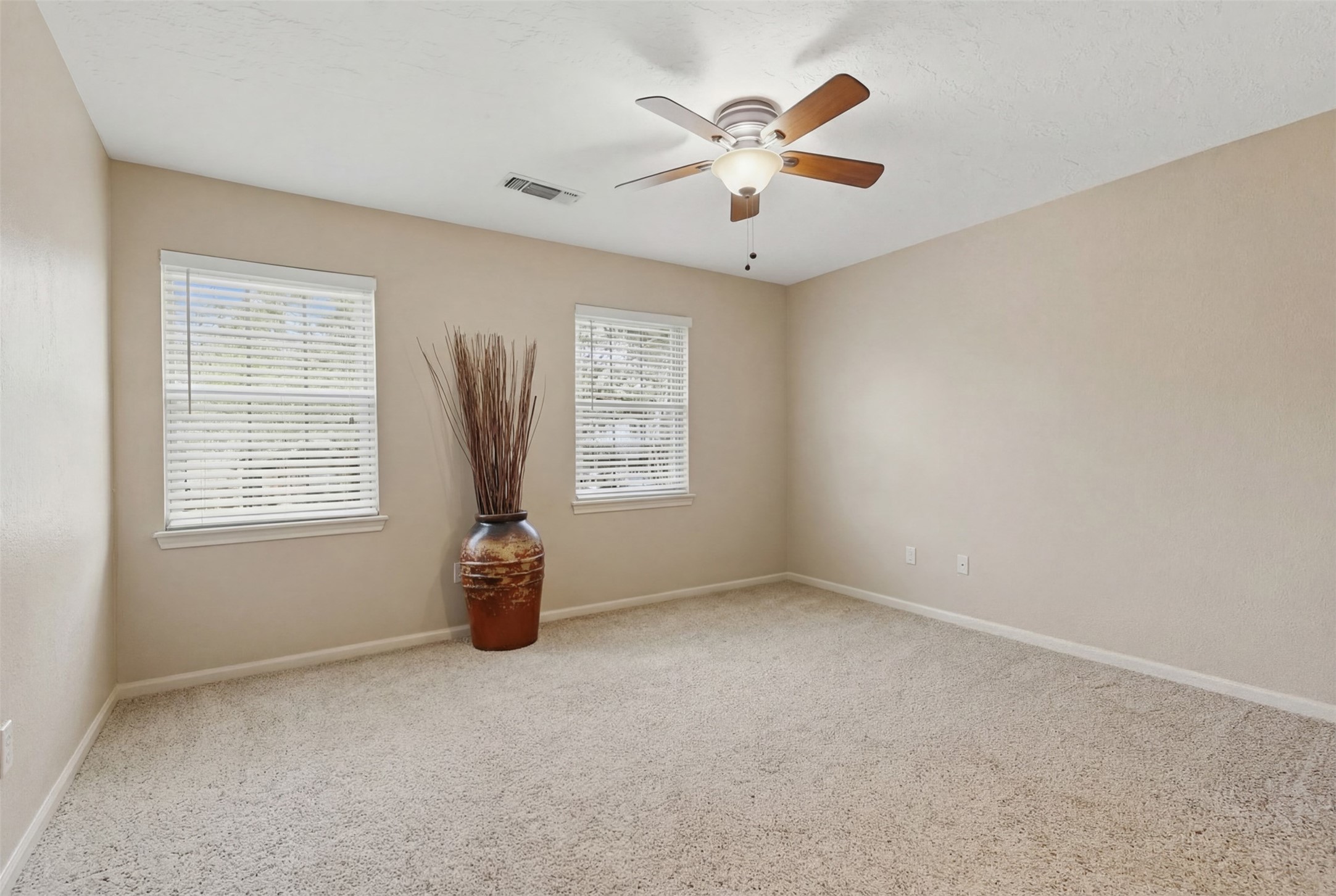 3415 Flickering Candle Drive Spring, TX 77388 - Photo 34 of 36 an empty room with windows and fan