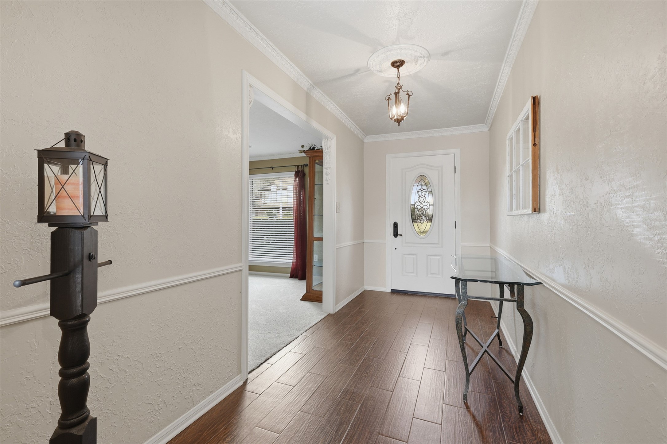 3415 Flickering Candle Drive Spring, TX 77388 - Photo 9 of 36 a view of a hallway with wooden floor and staircase