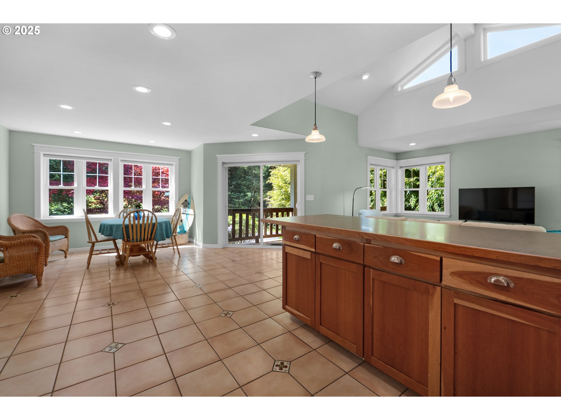 9330 Dewolf Road Nehalem, OR 97131 - Photo 12 of 24 a living room with couches and kitchen view with wooden floor