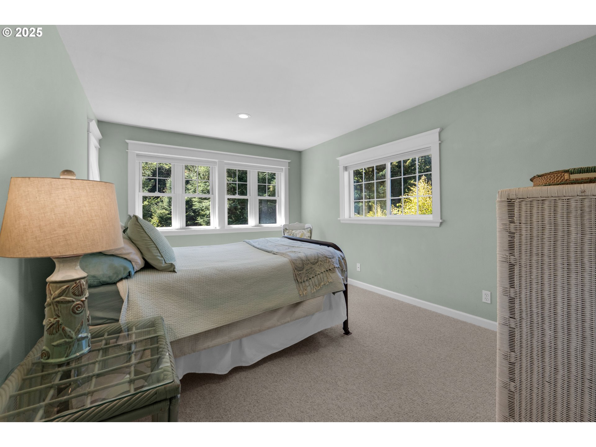 9330 Dewolf Road Nehalem, OR 97131 - Photo 14 of 24 a bedroom with a large bed and a window