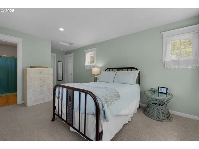 a bedroom with a bed and a lamp