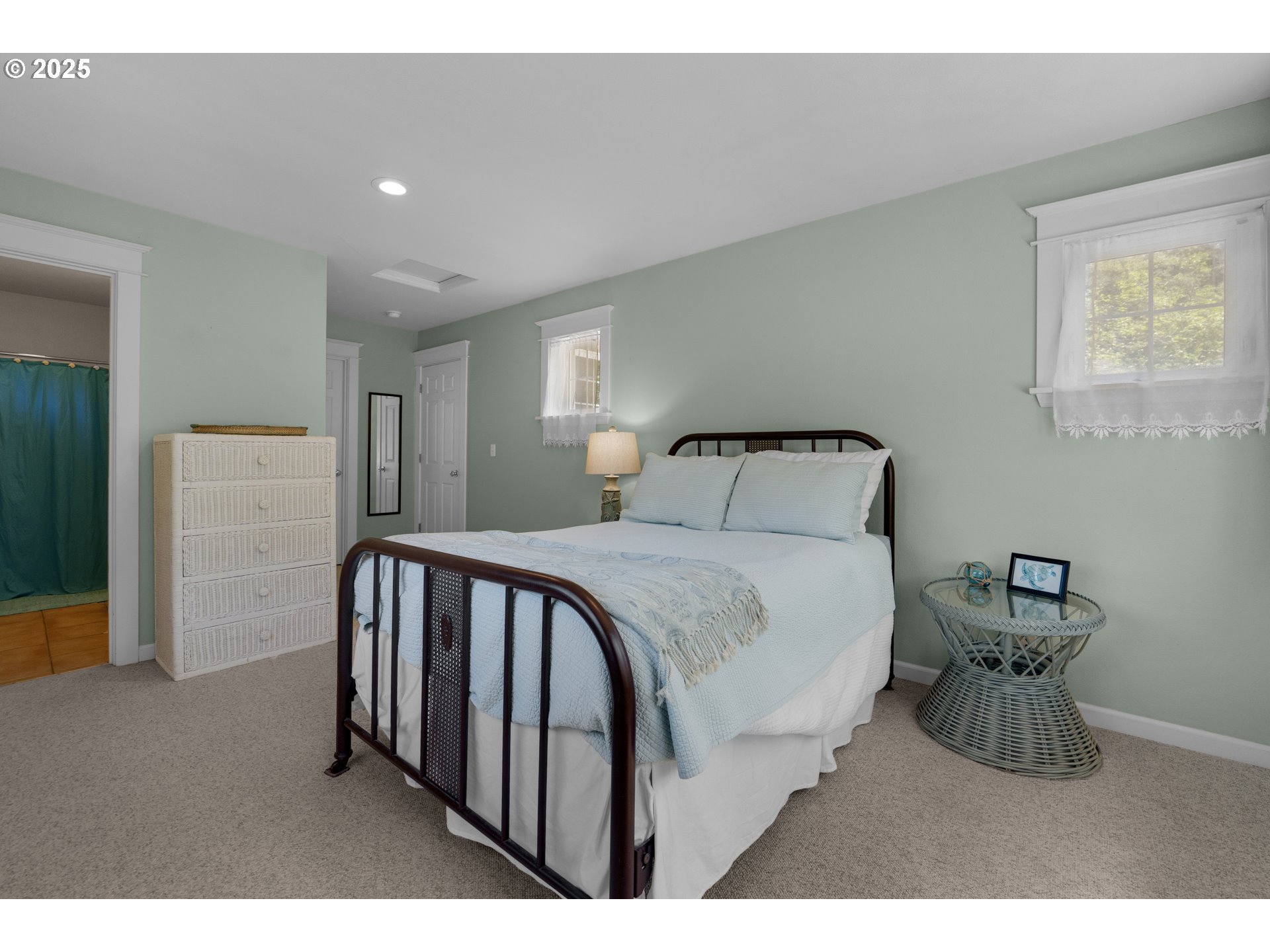 9330 Dewolf Road Nehalem, OR 97131 - Photo 15 of 24 a bedroom with a bed and a lamp