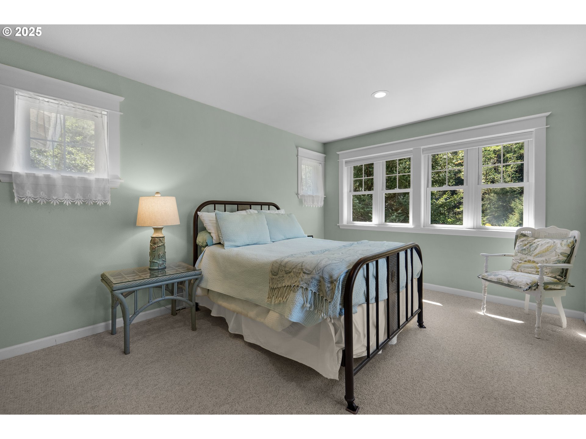 9330 Dewolf Road Nehalem, OR 97131 - Photo 16 of 24 a bedroom with a bed window and a chair