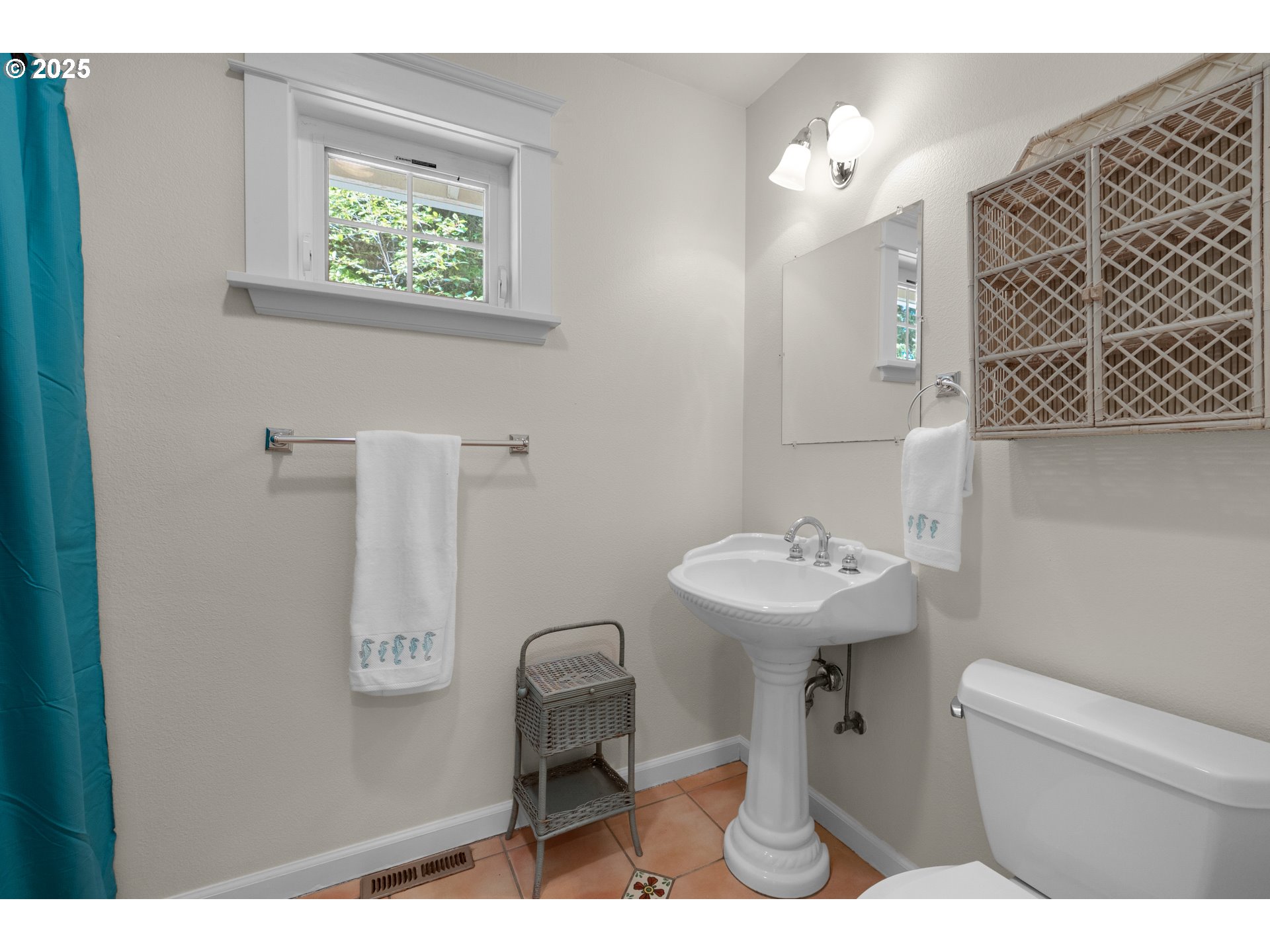 9330 Dewolf Road Nehalem, OR 97131 - Photo 18 of 24 a bathroom with a sink a toilet and mirror