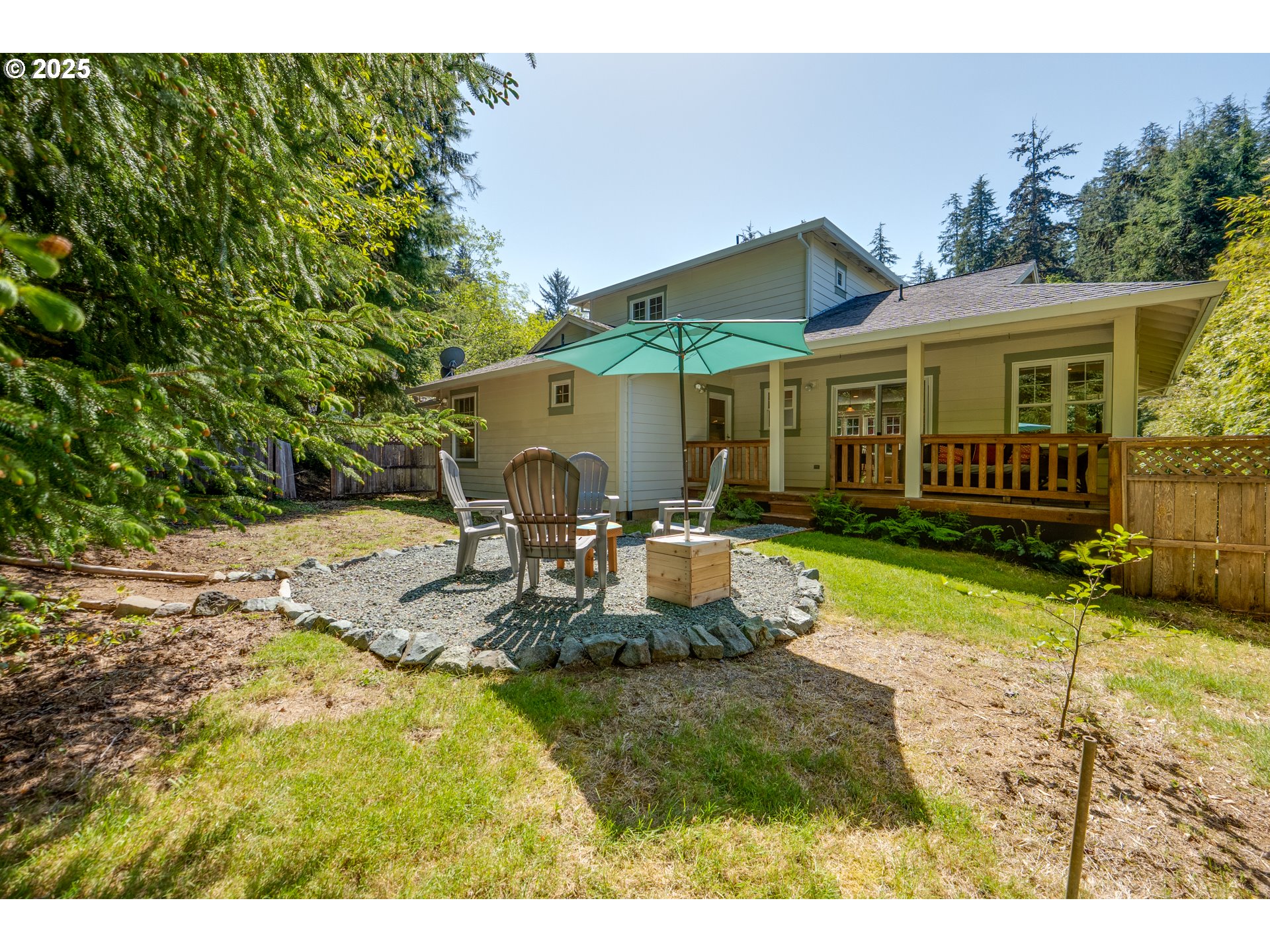 9330 Dewolf Road Nehalem, OR 97131 - Photo 24 of 24 a view of a house with backyard and sitting area