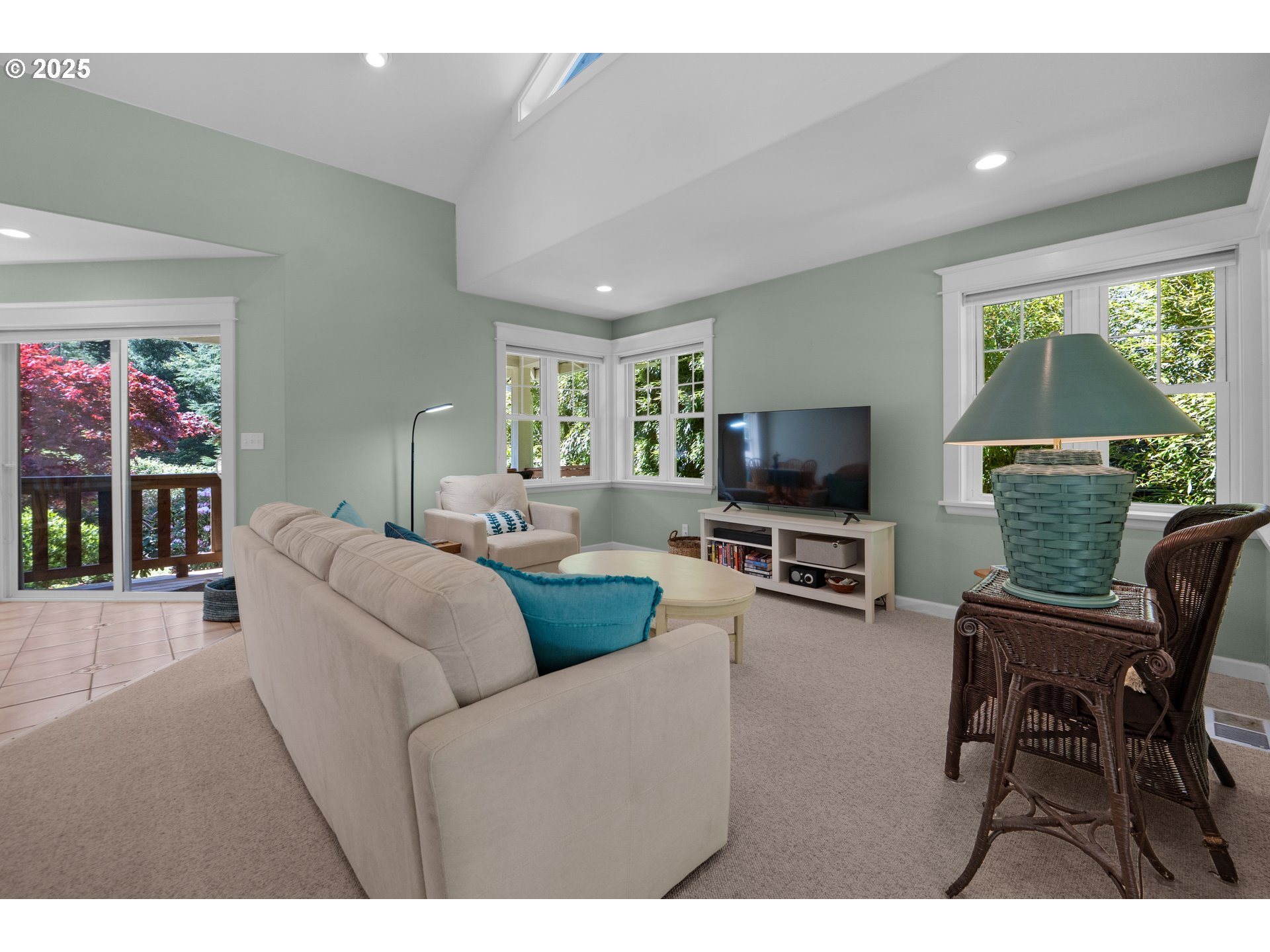 9330 Dewolf Road Nehalem, OR 97131 - Photo 7 of 24 a living room with furniture and a flat screen tv