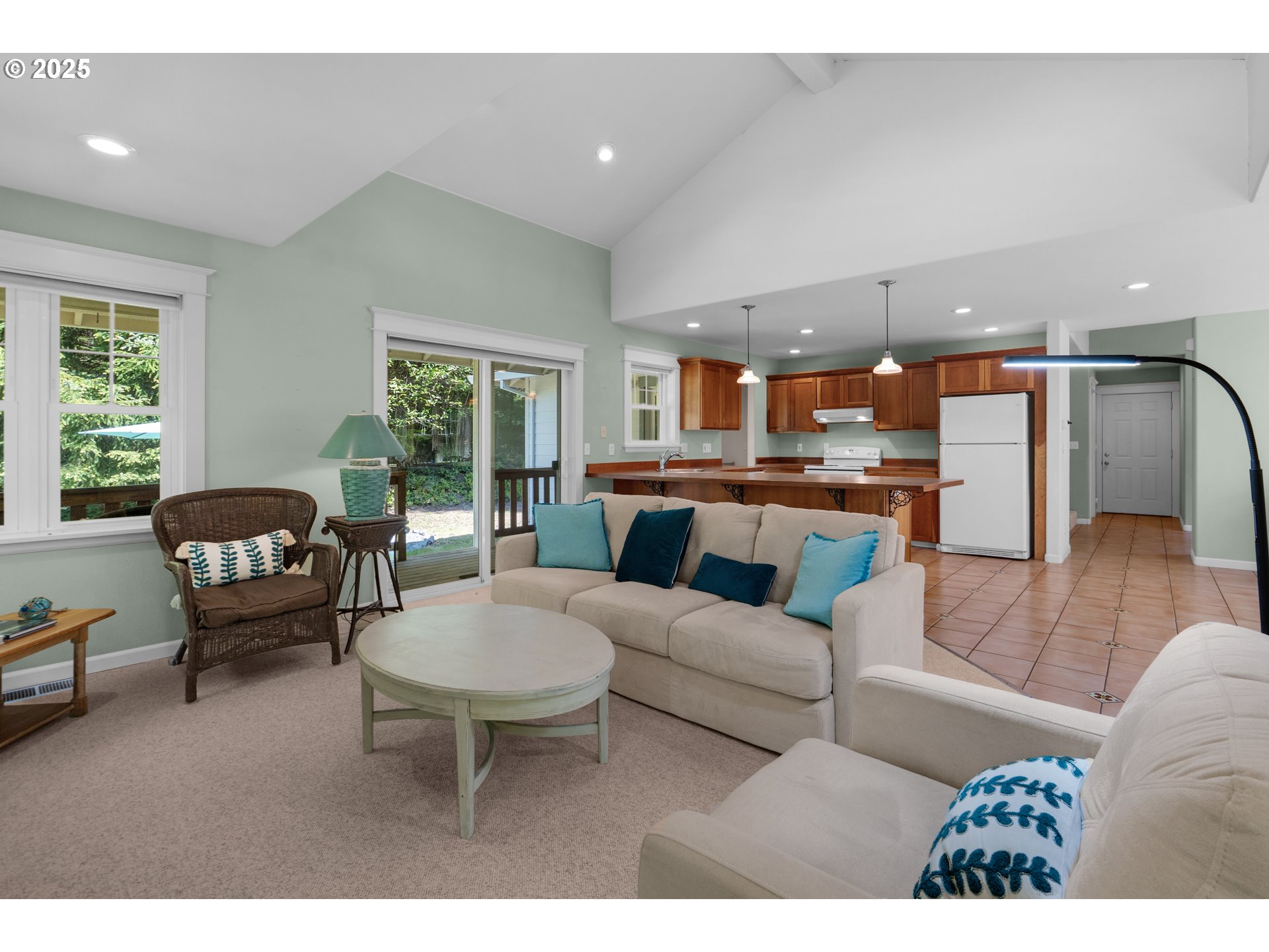 9330 Dewolf Road Nehalem, OR 97131 - Photo 9 of 24 a living room with furniture and a large window