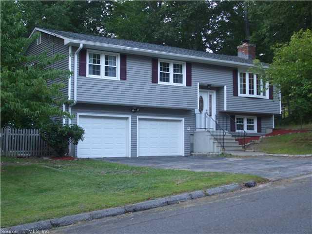 35 Bunting Road Seymour, CT 06483 - Photo 1 of 1 a front view of a house with a garden and yard