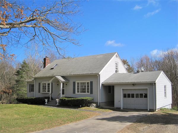 33 Smith Road Sutton, MA 01590 - Photo 1 of 16 a front view of a house with a yard