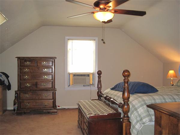 33 Smith Road Sutton, MA 01590 - Photo 13 of 16 a bedroom with a bed and a dresser