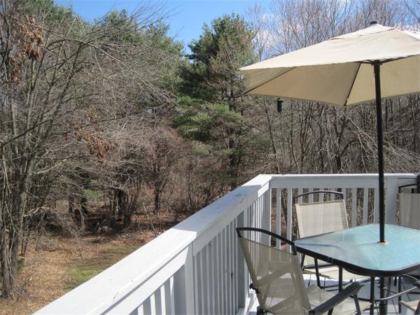 33 Smith Road Sutton, MA 01590 - Photo 15 of 16 a view of balcony with wooden floor and outdoor seating