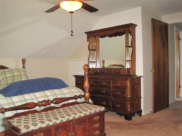 33 Smith Road Sutton, MA 01590 - Photo 5 of 16 a bedroom with a bed and a dresser
