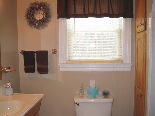 33 Smith Road Sutton, MA 01590 - Photo 8 of 16 a bathroom with a sink a toilet and a window