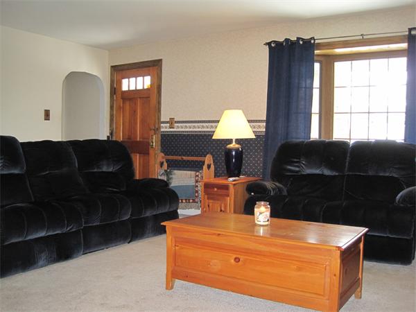 33 Smith Road Sutton, MA 01590 - Photo 9 of 16 a living room with furniture a window and a lamp