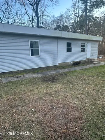 a view of a backyard with a barn
