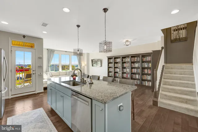 a view of an entryway with wooden floor