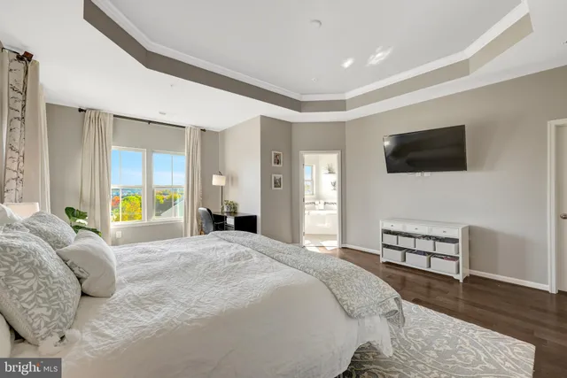 a bed room with a bed and chair