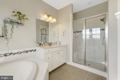 a bedroom with a bed chair and a window