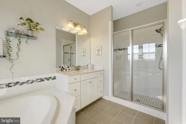 a bedroom with a bed chair and a window