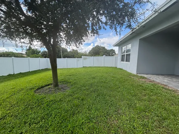 a backyard of a house with lots of green space