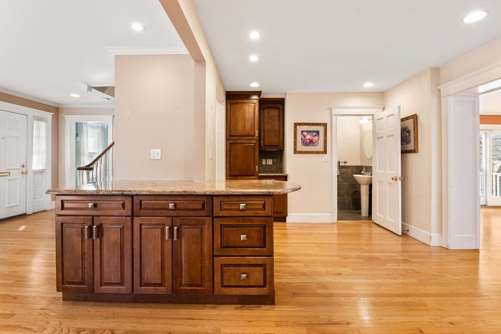35 Lovell Road Watertown, MA 02472 - Photo 11 of 42 a view of a kitchen with cabinets and wooden floor