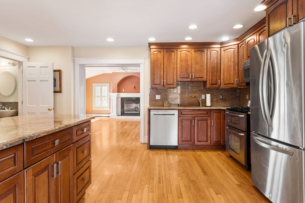 35 Lovell Road Watertown, MA 02472 - Photo 15 of 42 a kitchen with stainless steel appliances a refrigerator sink and cabinets
