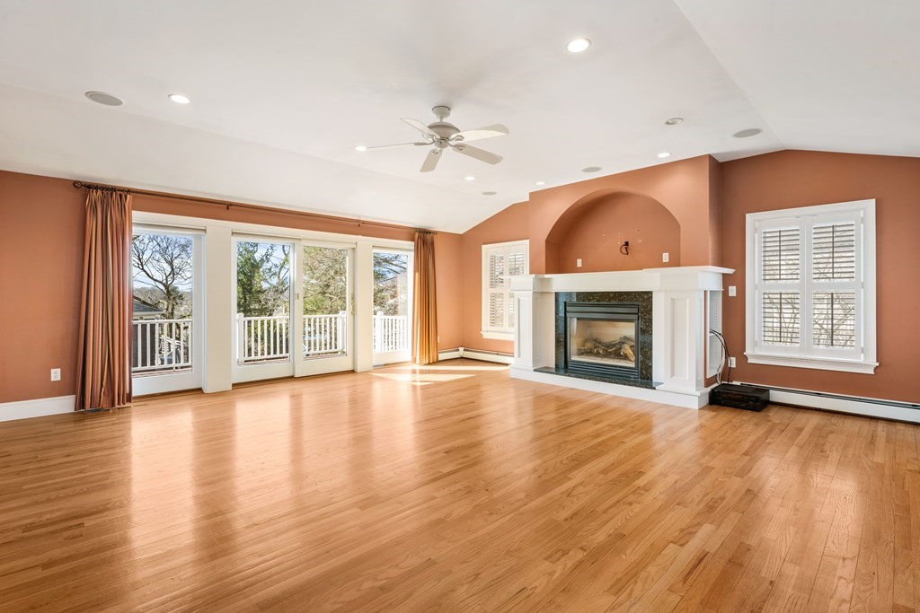 35 Lovell Road Watertown, MA 02472 - Photo 17 of 42 a view of an empty room with wooden floor fireplace and a window