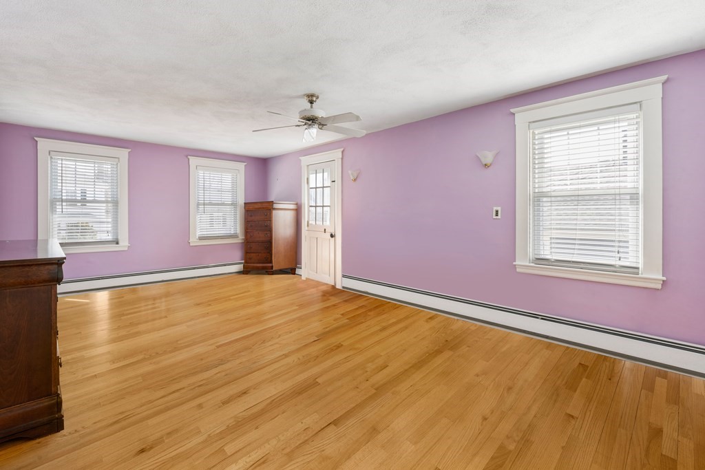 35 Lovell Road Watertown, MA 02472 - Photo 31 of 42 a view of an empty room with a window and wooden floor