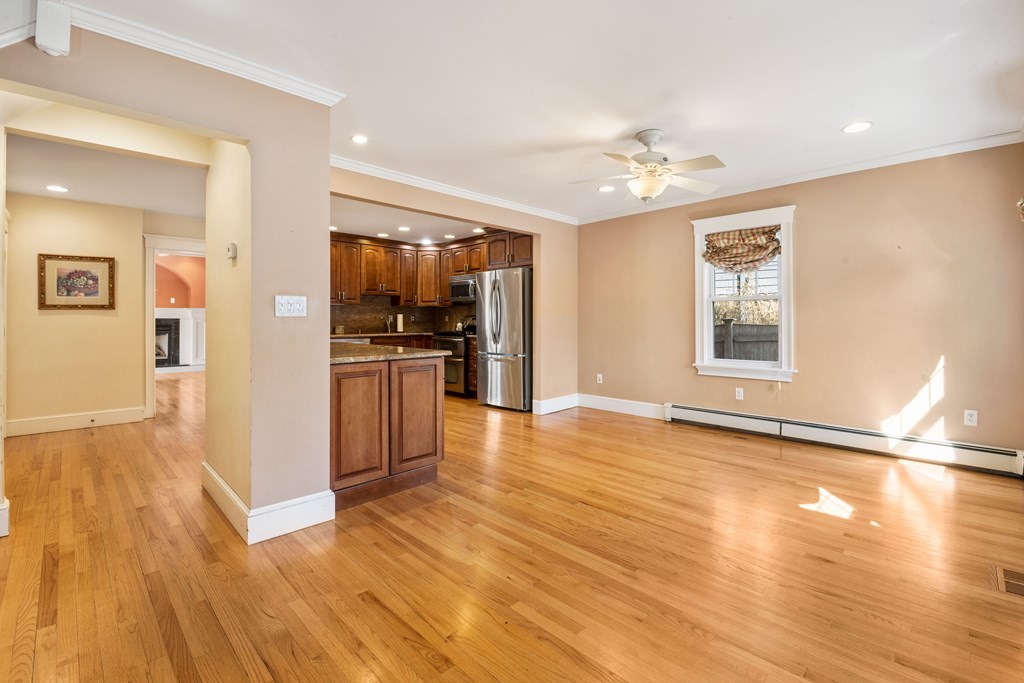 35 Lovell Road Watertown, MA 02472 - Photo 8 of 42 a view of a kitchen with a stove cabinets and wooden floor
