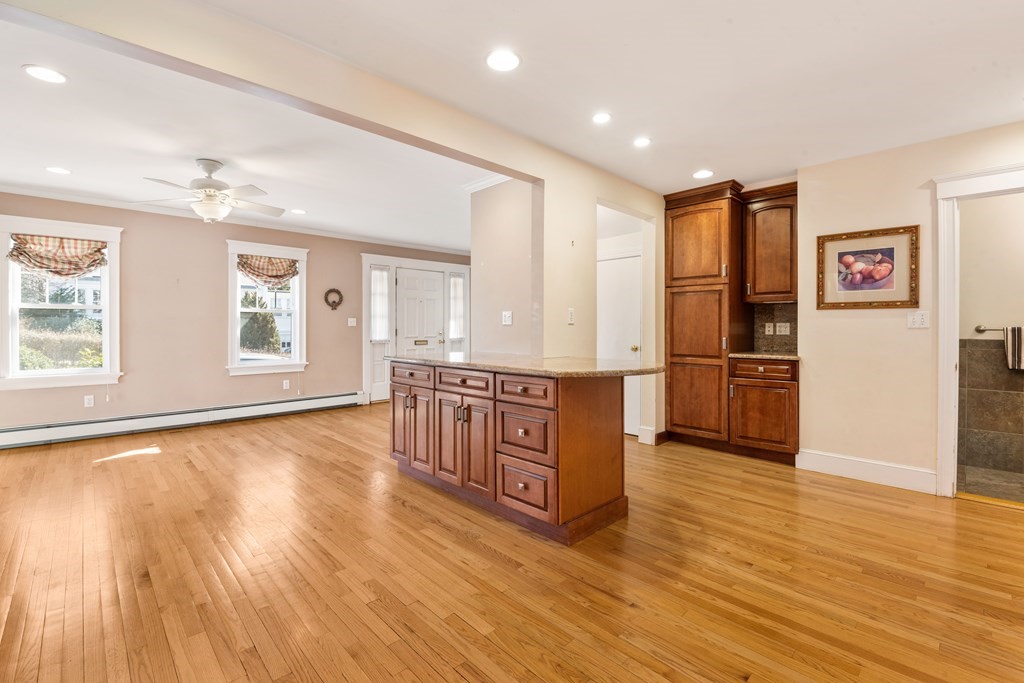 35 Lovell Road Watertown, MA 02472 - Photo 10 of 42 a view of kitchen with stainless steel appliances granite countertop a stove top oven a refrigerator a sink and dishwasher with wooden floor