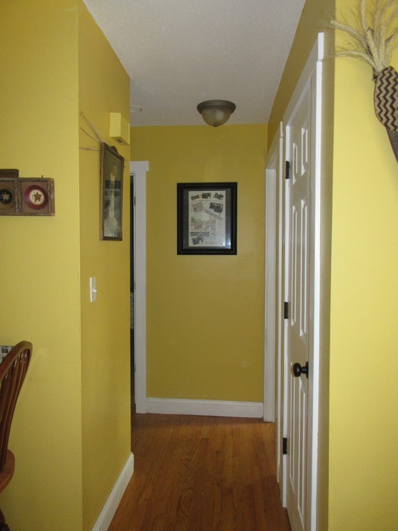 731 Florence Road Northampton, MA 01062 - Photo 14 of 29 a view of a hallway with paintings on the wall