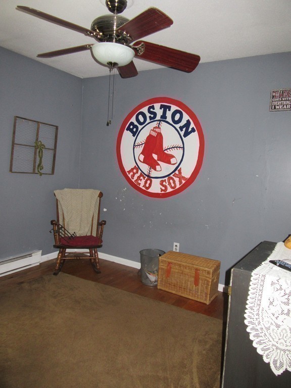 731 Florence Road Northampton, MA 01062 - Photo 18 of 29 a view of a room with furniture and a chandelier fan
