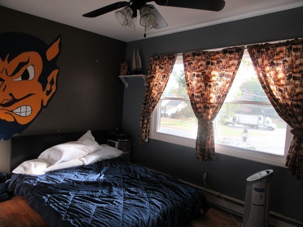 731 Florence Road Northampton, MA 01062 - Photo 20 of 29 a bed sitting in a bedroom next to a window