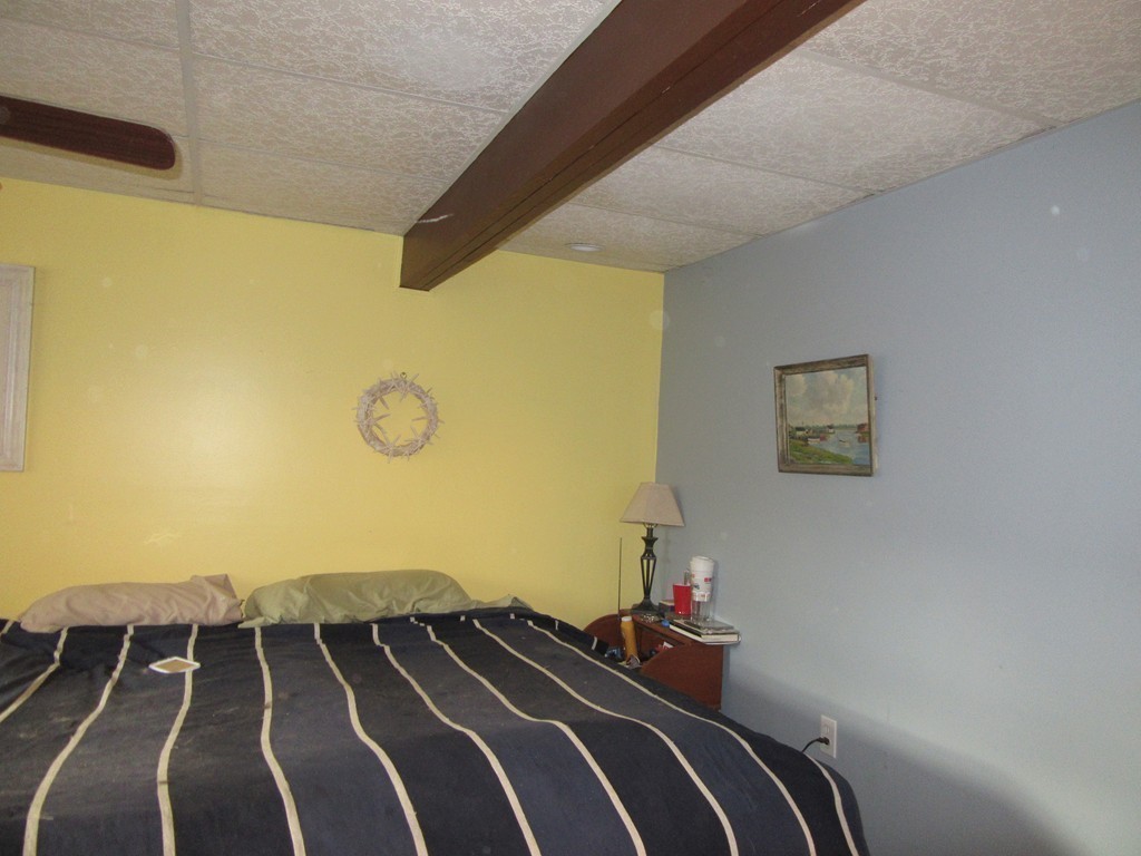 731 Florence Road Northampton, MA 01062 - Photo 22 of 29 a bedroom with a bed and cupboard