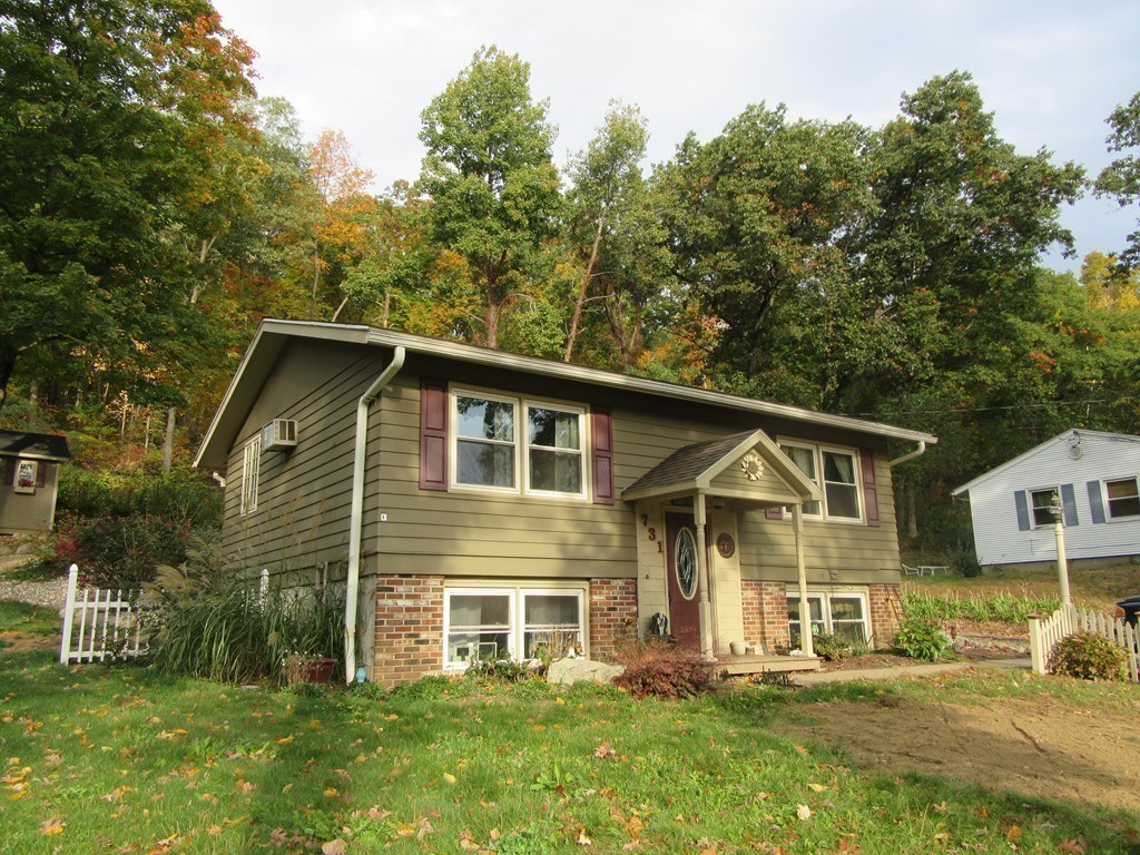 731 Florence Road Northampton, MA 01062 - Photo 25 of 29 a front view of a house with a garden