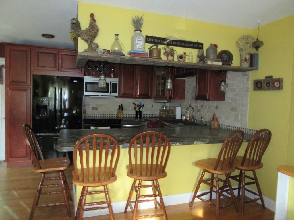 731 Florence Road Northampton, MA 01062 - Photo 5 of 29 a view of a chair and table in the kitchen