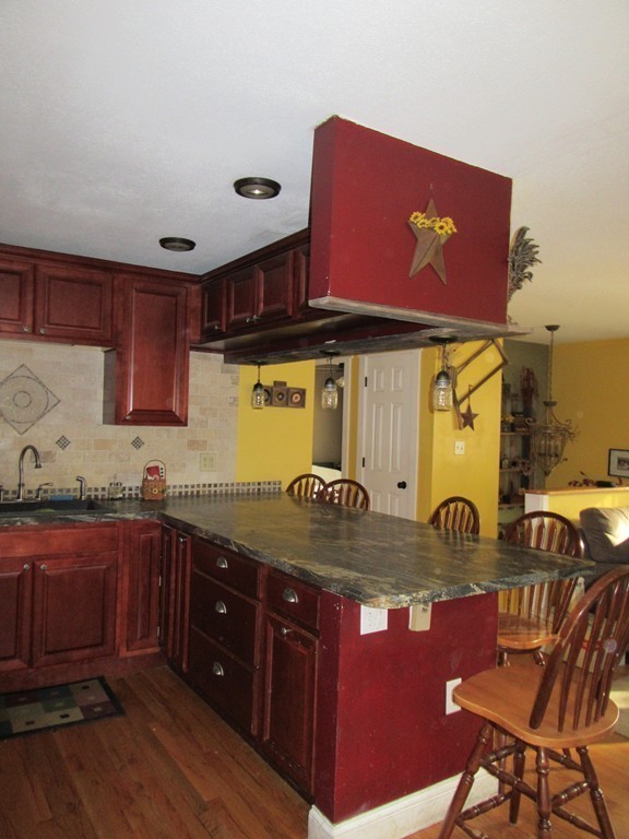 731 Florence Road Northampton, MA 01062 - Photo 8 of 29 a kitchen with a sink and wooden cabinets