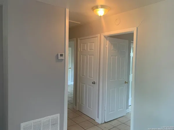 a bathroom with a shower and a glass door