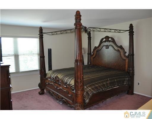 7104 Hana Road Edison, NJ 08817 - Photo 6 of 10 a living room with hard wood floors and a window